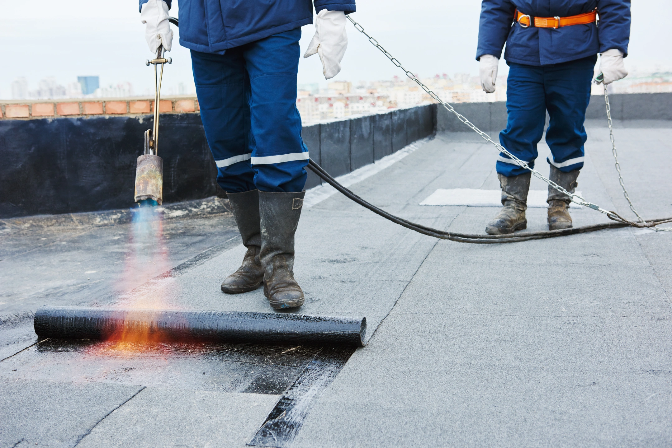 workers installing a flat roof