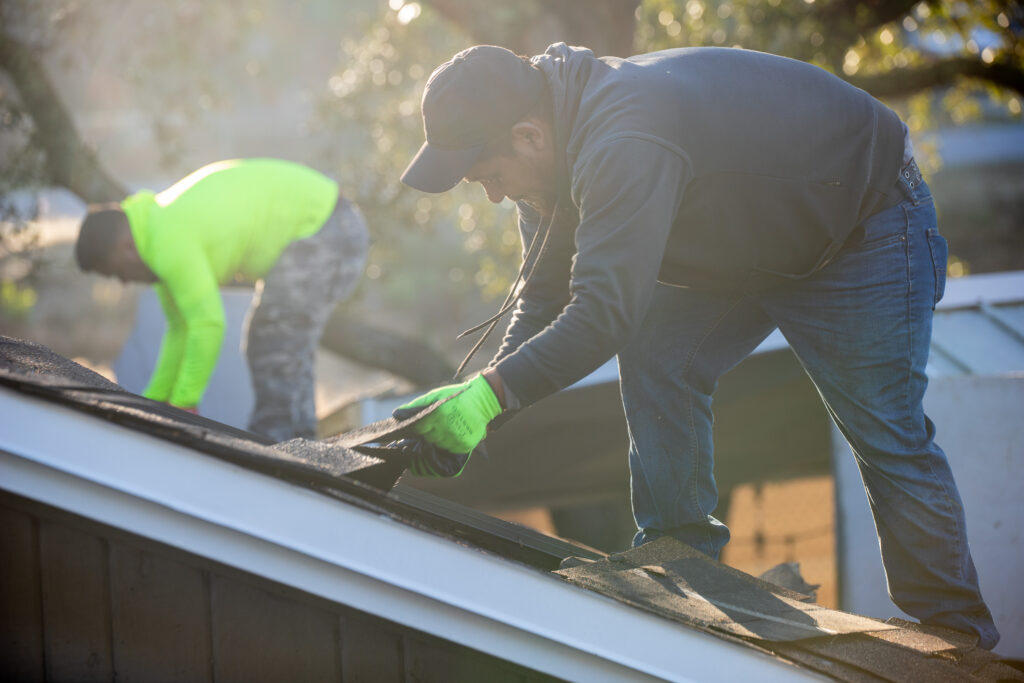 roofers working with shingles
