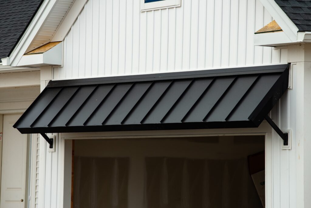 black awning door steel front wall shadow