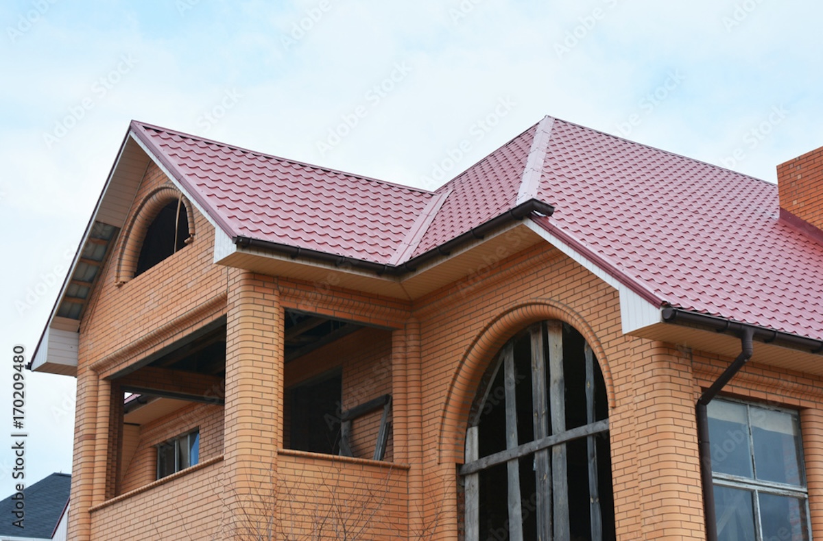 brick house red metal tile roof