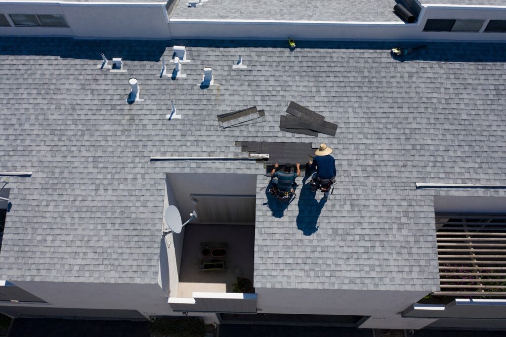 Roof Repair Inspection In Progress Aerial Above Head Condo Building Gray Shingles 2 Roofers