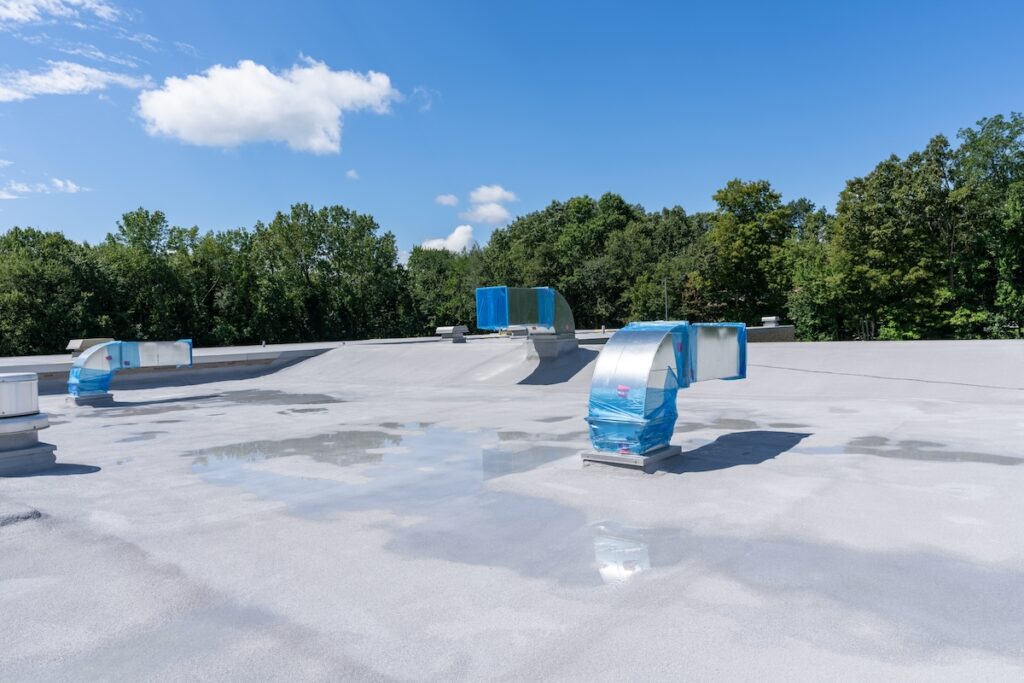 white commercial roofing with vents