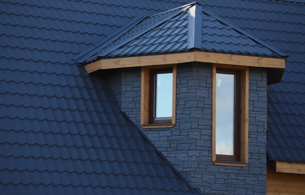 The roof is made of blue metal tiles.