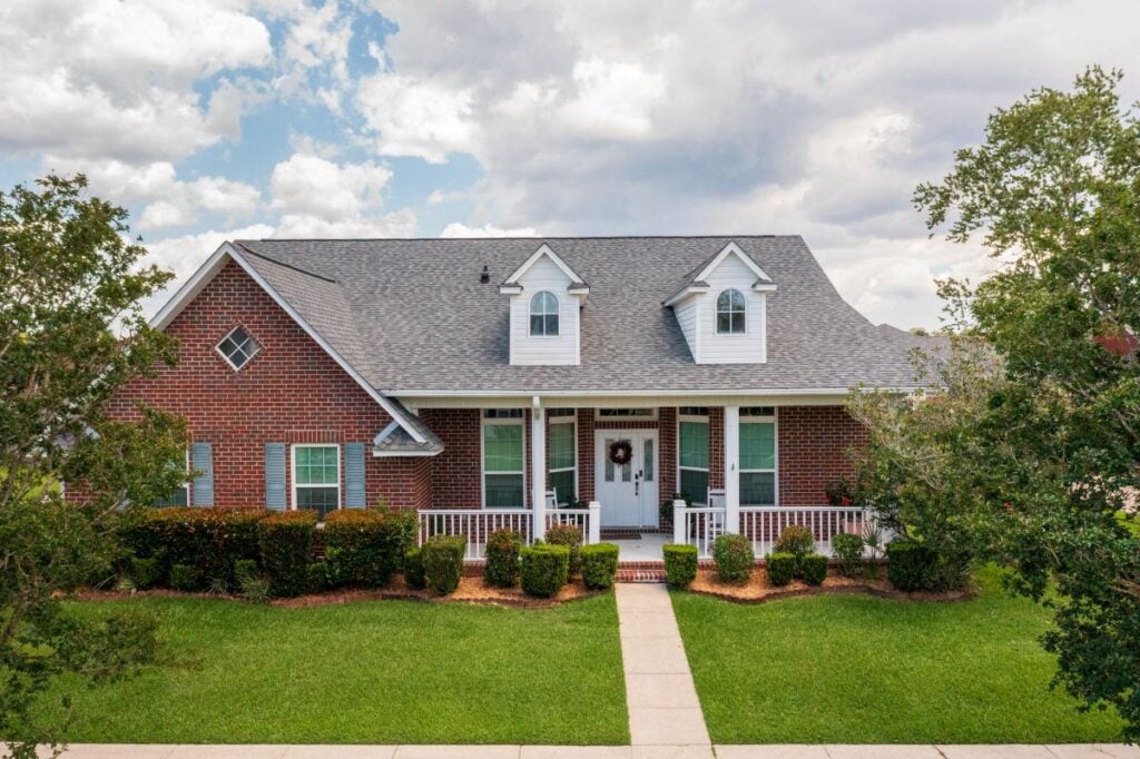 brick house with shingle roof