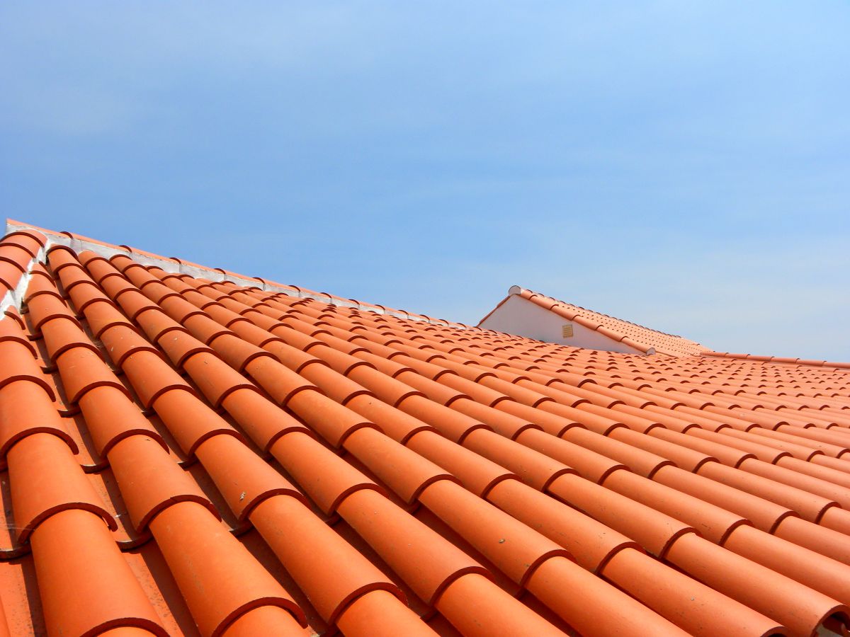 close-up view of tile roof against blue sky