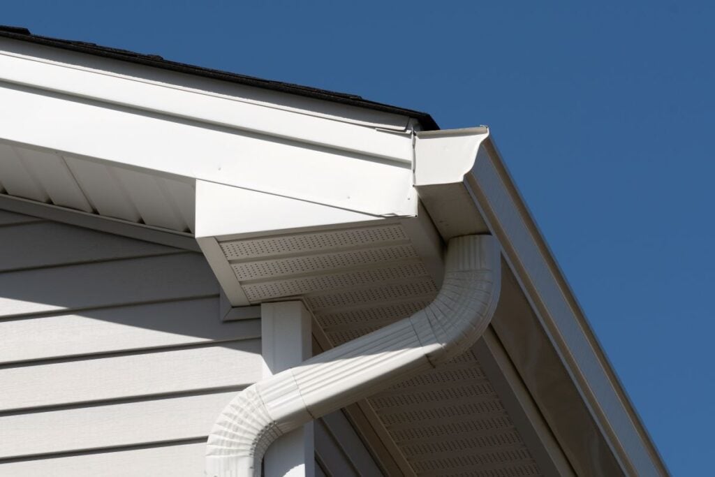 colonial white gutter guard system, fascia, drip edge, soffit providing ventilation to the attic