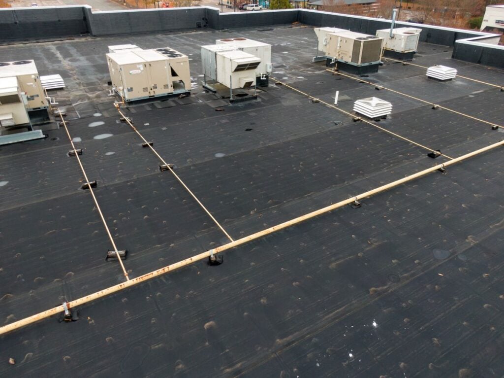 EPDM vs TPO black roof commercial building