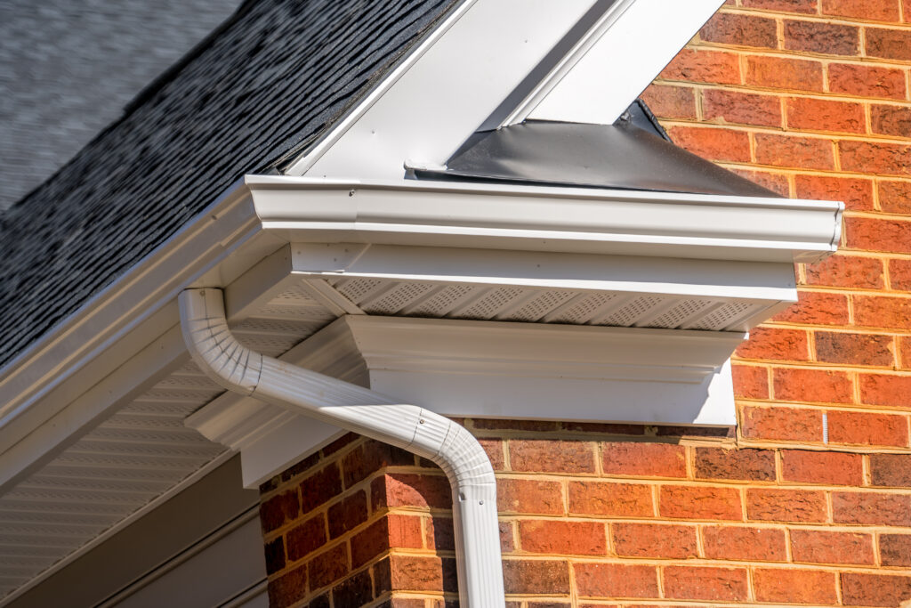 view of white gutter system with soffit vent