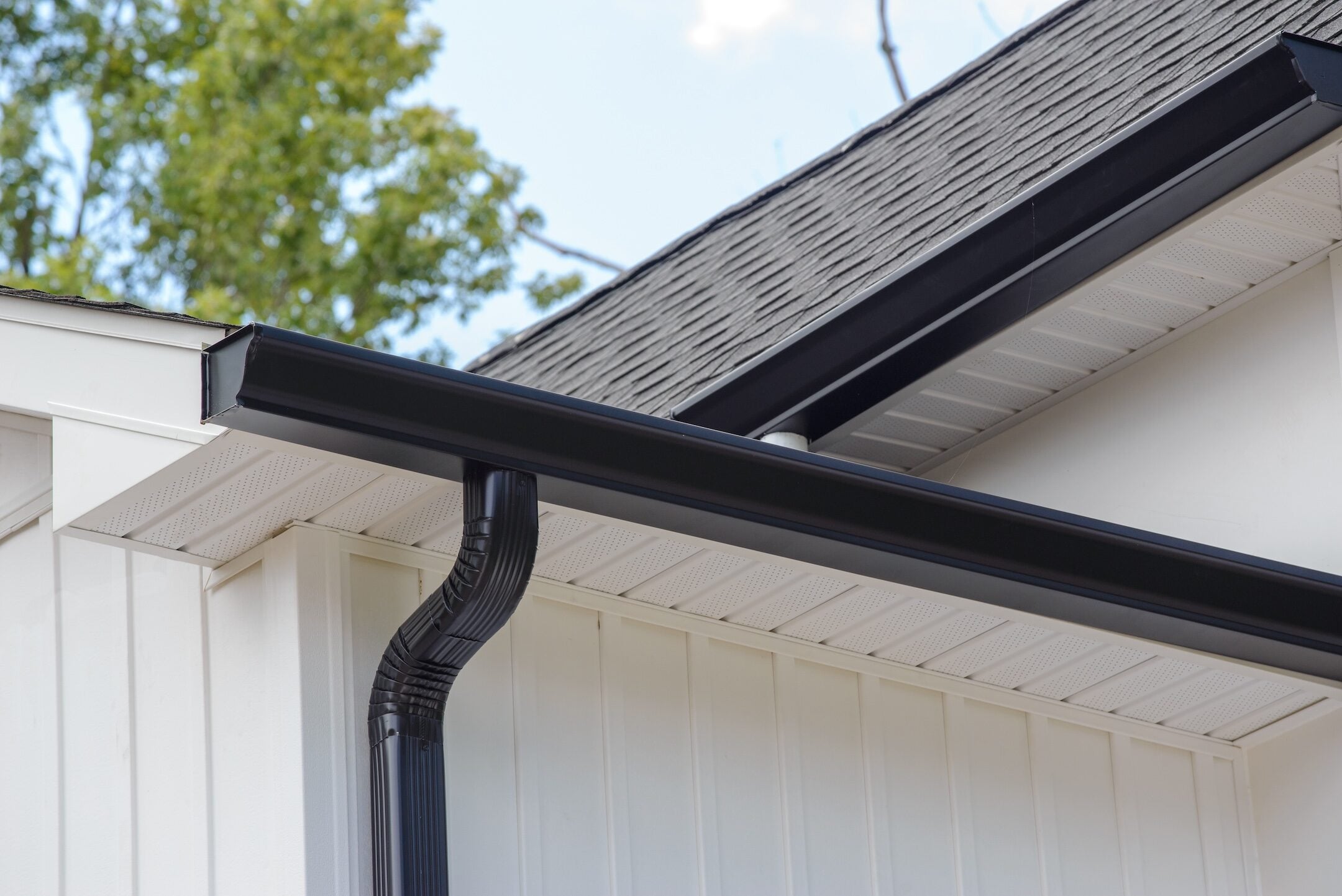 rain gutter of roof with downpipe metal corner wall rooftop