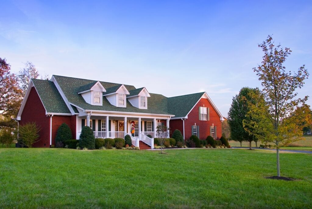 red brick and green asphalt shingles