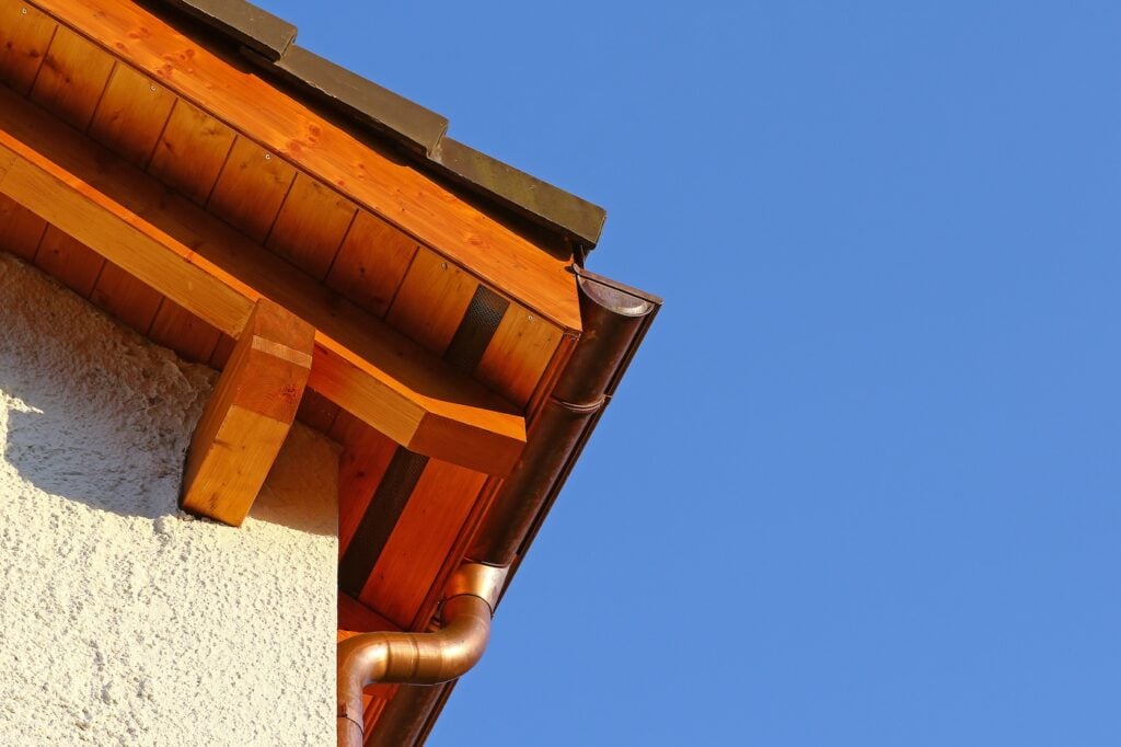wood flashing and copper gutter