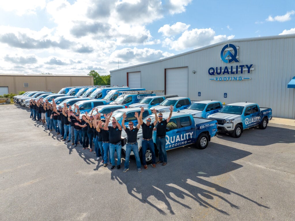 Quality Roofing Solutions team at the company office in Pensacola, FL