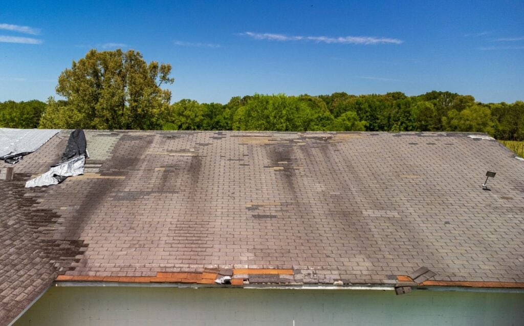 Roof missing shingles from weather and storm damage