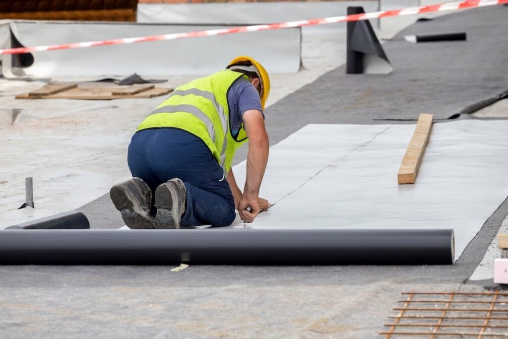 roofers replacing a commercial roof
