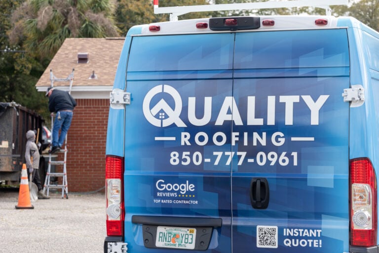 Quality Roofing Solutions Service Van & Crew Inspecting a Roof