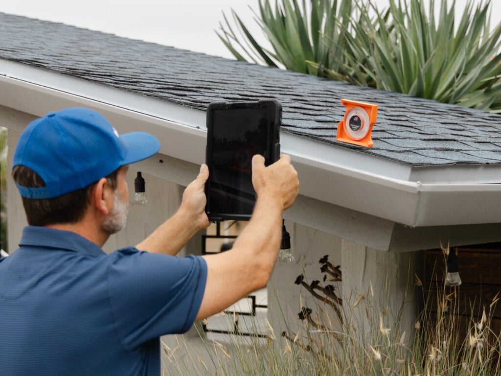 roof inspection for insurance guy taking pictures