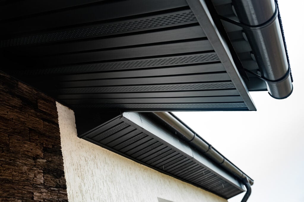 soffit repair Roof showing gutters and soffit on house.