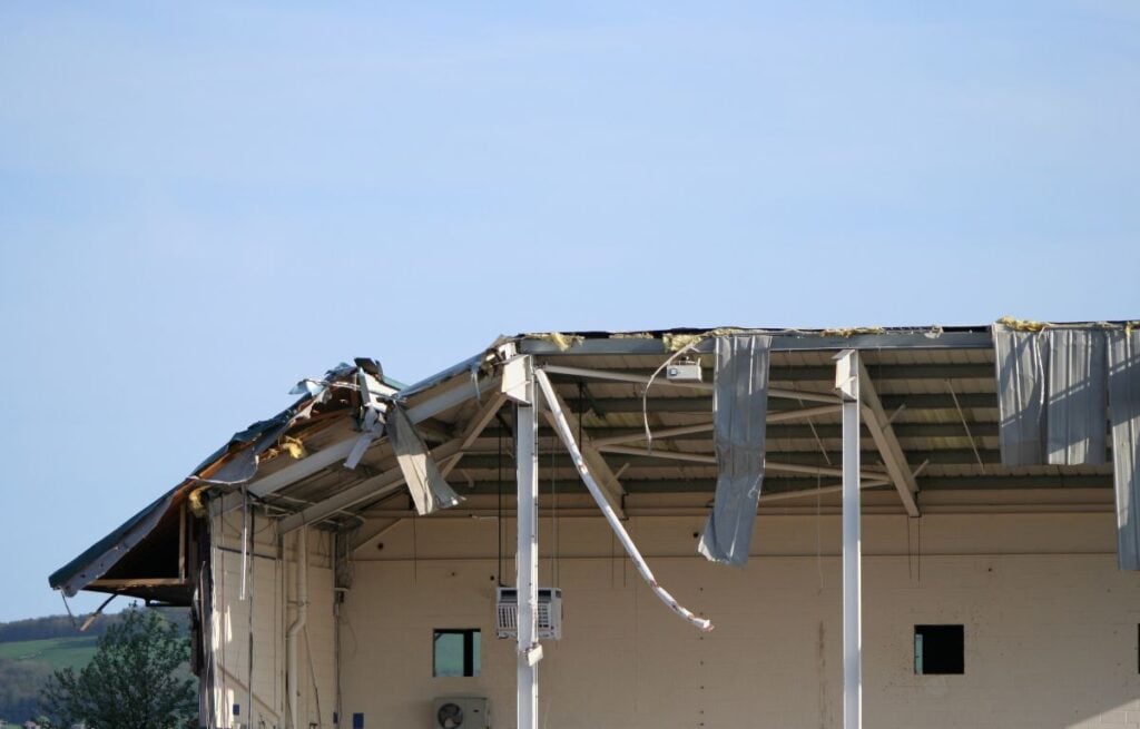 commercial storm damage metallic roof destroyed