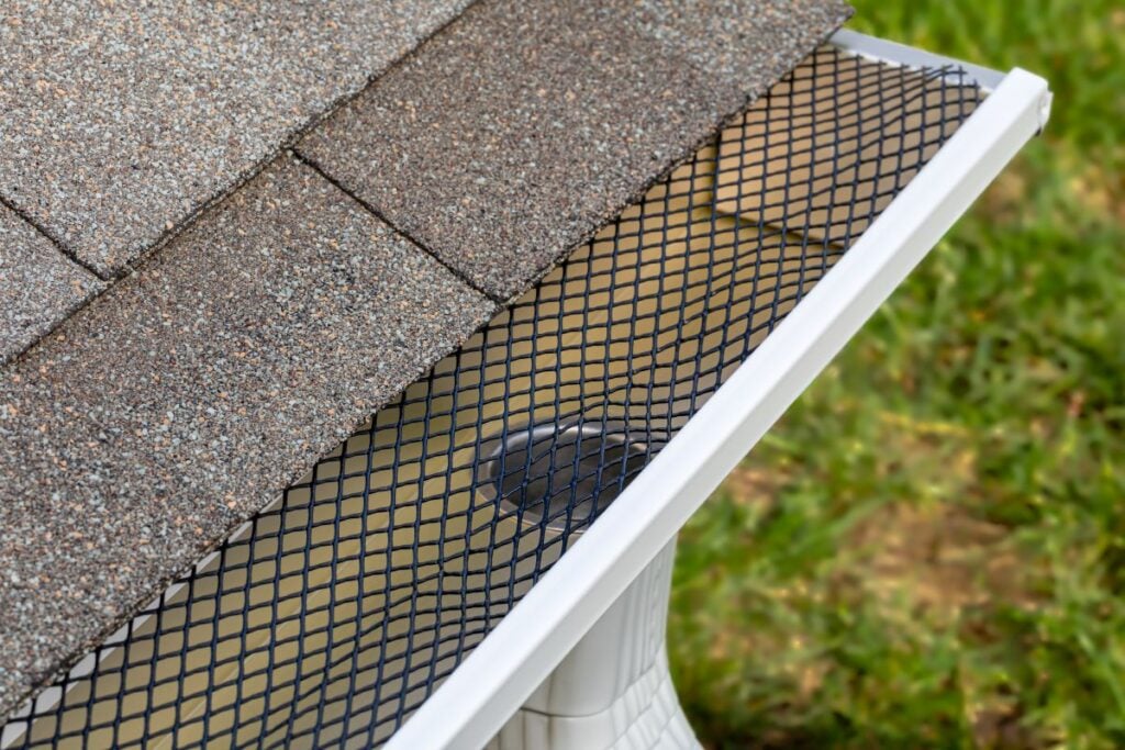 best gutter guards close up grey shingles roof
