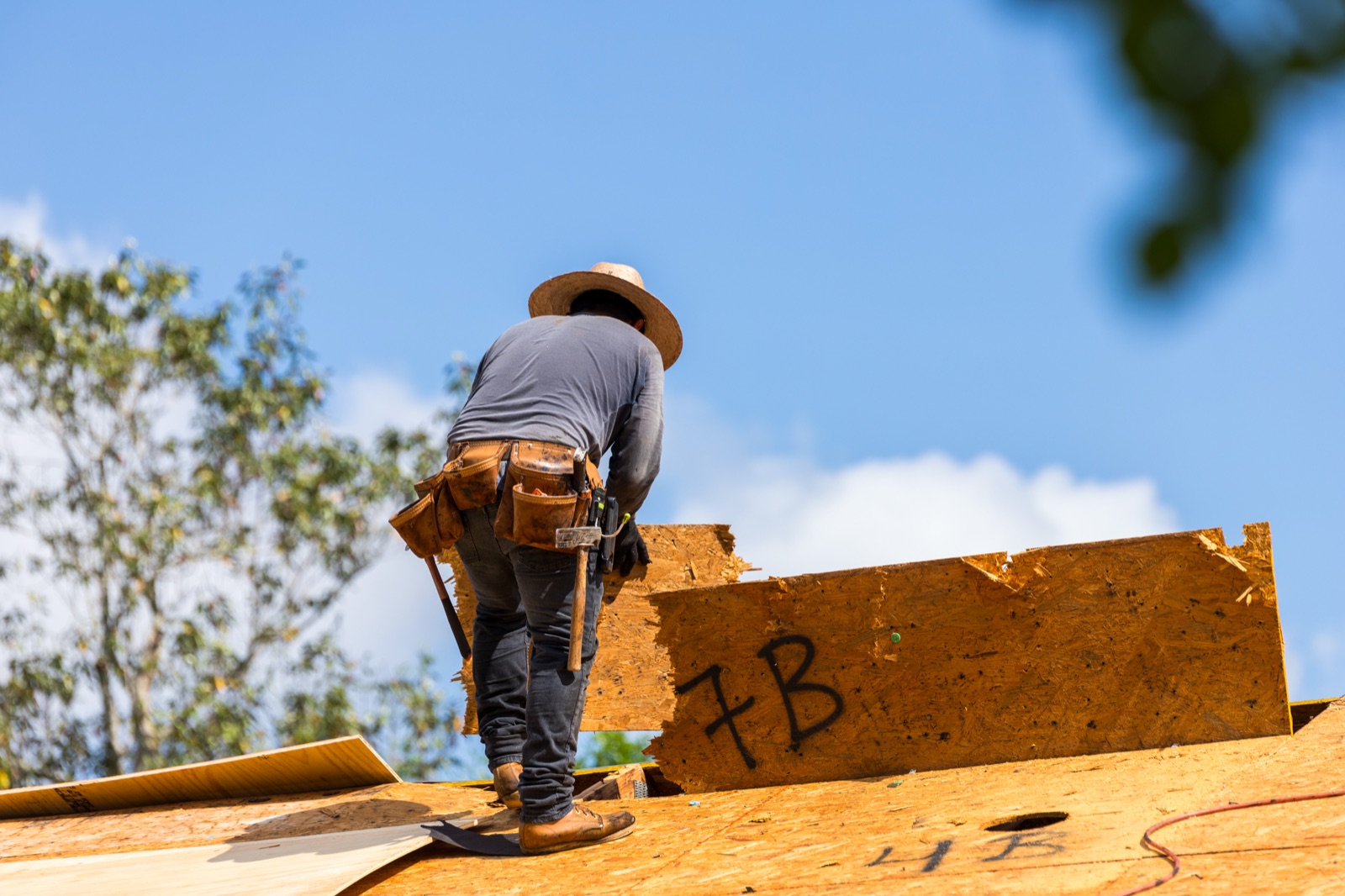 Quality Roofing Solutions roofer on a new roof deck in Pensacola, FL