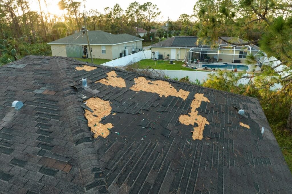 shingles removed from roof after storm