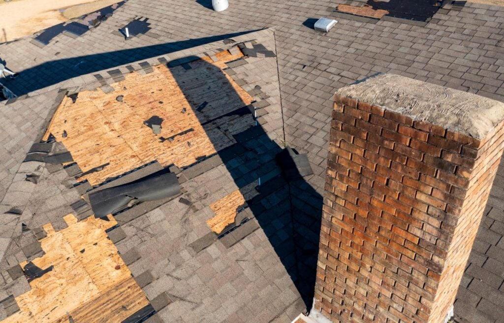 storm damage roof repair shingles roof missing wooden board