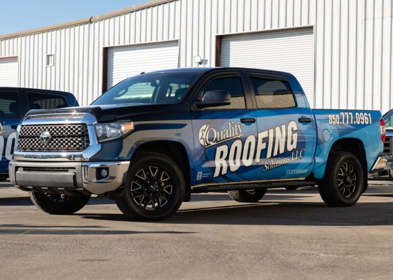 best roofing companies truck parked outside warehouse
