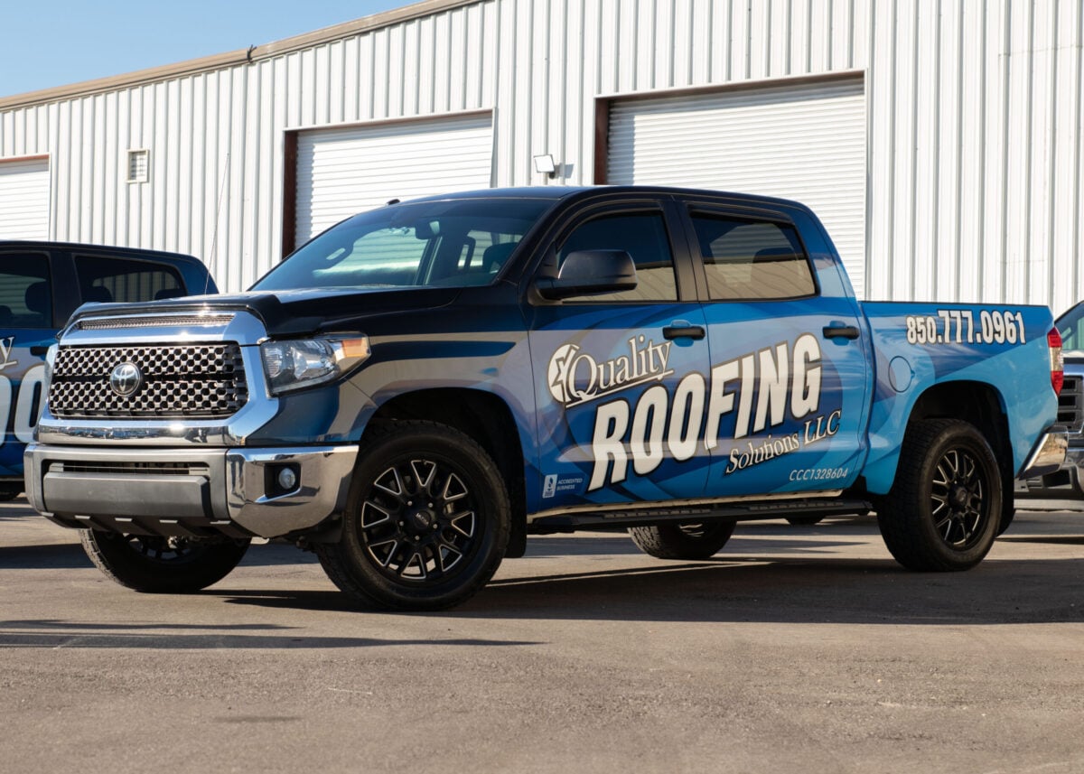 best roofing companies truck parked outside warehouse